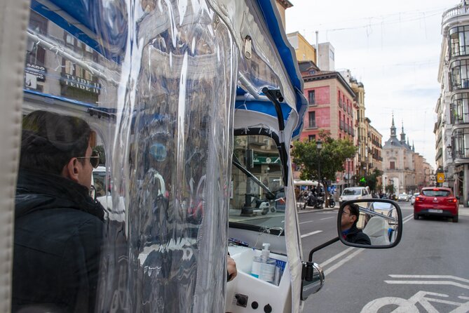 Eco Friendly Tuk Tuk Experience with the Local in Madrid - San Miguel Market and the Guinness-Record Botín Story